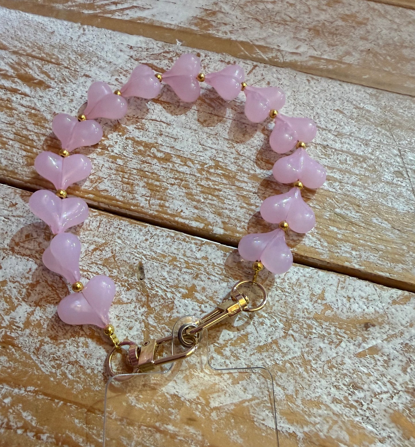 Hartjes telefoonkoord doorzichtig roze